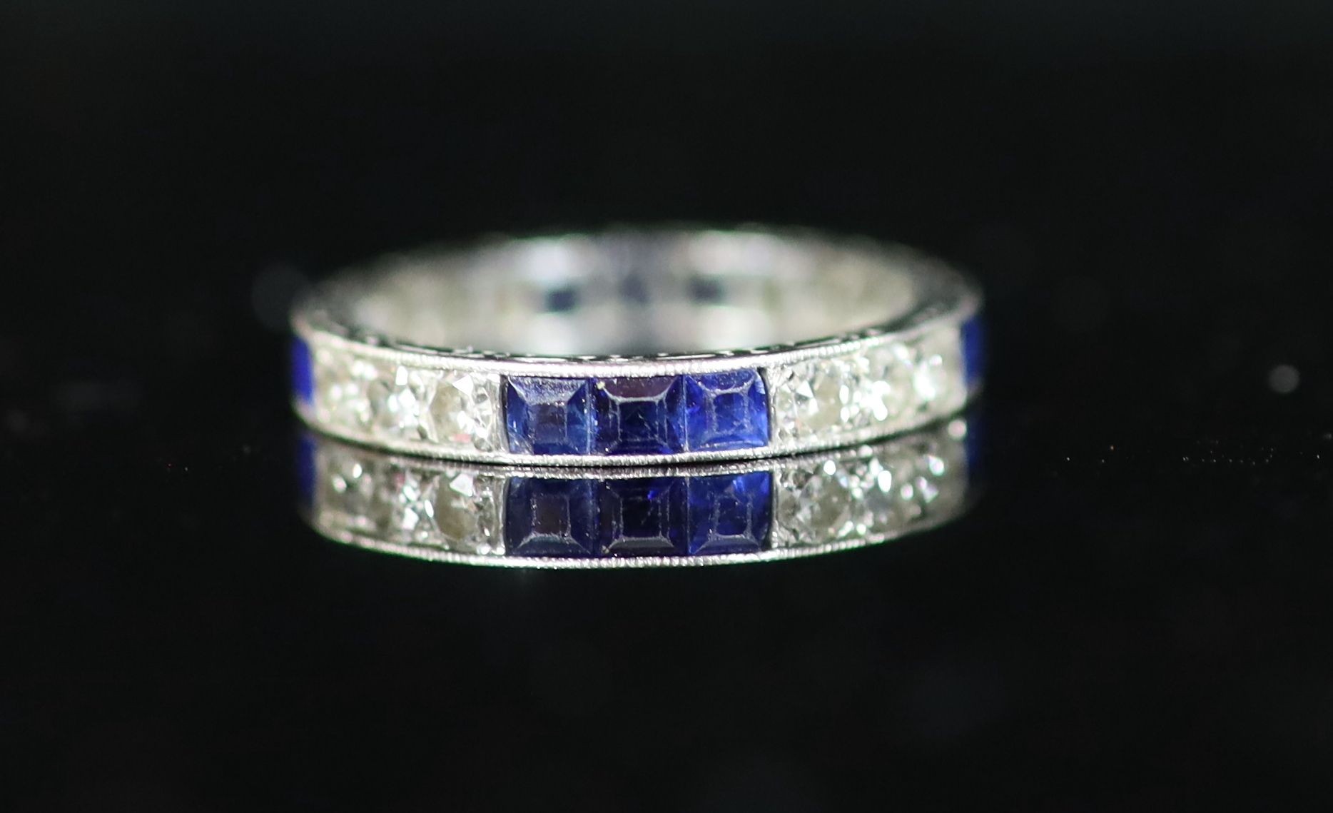 A platinum, sapphire and diamond set full eternity ring